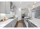 Charming kitchen features stainless appliances, a large sink, and plentiful counter space at 213 Chateau Way, Angier, NC 27501