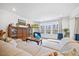 Comfortable living room with plush seating, elegant furnishings, and a large window at 213 Chateau Way, Angier, NC 27501