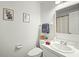 Well-lit bathroom featuring a vanity, toilet, and towel rack at 2204 Gentry Dr, Durham, NC 27705