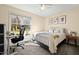 Bedroom features a bed, desk, and a large window for ample natural light at 2204 Gentry Dr, Durham, NC 27705