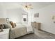 Vaulted bedroom features a bed with throw pillows, a ceiling fan, and a dresser at 2204 Gentry Dr, Durham, NC 27705