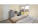 Bedroom features a bed, desk, and a window overlooking the outside at 2204 Gentry Dr, Durham, NC 27705