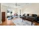 Versatile bonus room with comfortable seating, workout area, and natural light for various activities at 2204 Gentry Dr, Durham, NC 27705