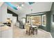 Cozy eat-in kitchen featuring modern appliances, white cabinetry, and a dining area with a bay window at 2204 Gentry Dr, Durham, NC 27705