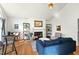 Cozy living room featuring a fireplace, hardwood floors, and comfortable seating at 2204 Gentry Dr, Durham, NC 27705