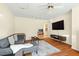 Cozy living room featuring a comfortable sofa, entertainment setup, and easy access to adjacent rooms at 2204 Gentry Dr, Durham, NC 27705