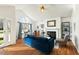 Bright living room with hardwood floors, fireplace, and large windows that offer ample sunlight at 2204 Gentry Dr, Durham, NC 27705