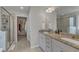 Modern bathroom featuring double sinks, granite countertops, and a glass door shower at 274 Roaring Creek Dr, Garner, NC 27529