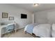 Bedroom with desk and mounted TV, offering a modern and functional space at 274 Roaring Creek Dr, Garner, NC 27529