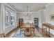 Formal dining room boasting large windows, a wood table, and elegant decor at 274 Roaring Creek Dr, Garner, NC 27529