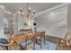 Bright dining room with a wooden table, elegant decor, hardwood floors, and light gray walls at 274 Roaring Creek Dr, Garner, NC 27529