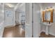 Welcoming entryway leading to a dining room and a pedestal sink powder room at 274 Roaring Creek Dr, Garner, NC 27529