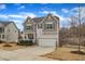 Beautiful two-story home with a front porch and a two-car garage, nestled on a well-manicured lot at 274 Roaring Creek Dr, Garner, NC 27529