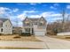 Attractive two-story home featuring a covered front porch and an attached two-car garage at 274 Roaring Creek Dr, Garner, NC 27529