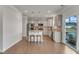 Spacious kitchen featuring stainless steel appliances, a central island, and access to an outdoor deck at 274 Roaring Creek Dr, Garner, NC 27529