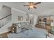 Open-concept living room with hardwood floors and a view of the kitchen and dining area at 274 Roaring Creek Dr, Garner, NC 27529