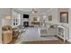 Bright and airy living room with hardwood floors, fireplace, and lots of natural light from a large window at 274 Roaring Creek Dr, Garner, NC 27529