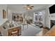 Open concept living space with hardwood floors, fireplace, kitchen, dining area, and lots of light at 274 Roaring Creek Dr, Garner, NC 27529