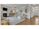 Cozy living room with hardwood floors, fireplace, and comfortable seating with lots of natural light at 274 Roaring Creek Dr, Garner, NC 27529