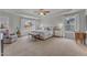 Bright main bedroom with a ceiling fan, tray ceiling, and lots of natural light at 274 Roaring Creek Dr, Garner, NC 27529