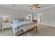 Bright and airy main bedroom featuring tray ceilings and a glimpse into the bathroom at 274 Roaring Creek Dr, Garner, NC 27529