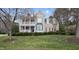 Charming home featuring a welcoming front porch and well-manicured landscaping at 318 Belles Landing Ct, Cary, NC 27519