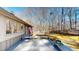 Back exterior of home with a deck overlooking the mature backyard trees at 3306 Whitfield Rd, Chapel Hill, NC 27514
