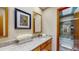 Bathroom featuring granite countertops, a stylish mirror, and a shower/tub combo at 3306 Whitfield Rd, Chapel Hill, NC 27514