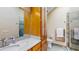 Modern bathroom with sleek cabinets, updated fixtures, and a glass shower, offering a spa-like experience at 3306 Whitfield Rd, Chapel Hill, NC 27514