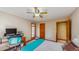 Comfortable bedroom featuring a ceiling fan, and a window to the nature outside at 3306 Whitfield Rd, Chapel Hill, NC 27514