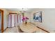 Elegant dining room with decorative screen and light wood table and chairs at 3306 Whitfield Rd, Chapel Hill, NC 27514
