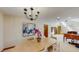 Formal dining room with an elegant chandelier and views into other living spaces at 3306 Whitfield Rd, Chapel Hill, NC 27514