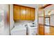 Convenient laundry room with washer, dryer, and overhead storage cabinets at 3306 Whitfield Rd, Chapel Hill, NC 27514