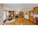 Cozy living room with a fireplace, built-in bookshelves, hardwood floors, and a comfortable chair at 3306 Whitfield Rd, Chapel Hill, NC 27514