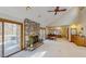 Open living room with fireplace and access to the deck at 3306 Whitfield Rd, Chapel Hill, NC 27514