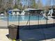 Outdoor pool with a slide, lifeguard stands, and fenced perimeter at 3306 Whitfield Rd, Chapel Hill, NC 27514