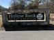 Stone wall sign for Hollow Rock Racquet & Swim Club including the logo at 3306 Whitfield Rd, Chapel Hill, NC 27514