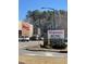 Walgreens Pharmacy sign with the UNC Health Care logo against a sunny sky at 3306 Whitfield Rd, Chapel Hill, NC 27514