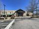 Harris Teeter grocery store featuring a brick and glass facade with ample parking at 3306 Whitfield Rd, Chapel Hill, NC 27514