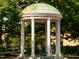 The UNC Chapel Hill Old Well framed by lush greenery and a tranquil setting at 3306 Whitfield Rd, Chapel Hill, NC 27514