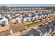 Expansive aerial view capturing the layout of a suburban community with fenced yards and well-kept homes at 3418 Longleaf Estates Dr, Raleigh, NC 27616