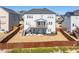 Expansive backyard with a covered patio and fenced perimeter, ideal for outdoor entertaining and privacy at 3418 Longleaf Estates Dr, Raleigh, NC 27616