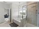 Bright bathroom featuring a soaker tub, separate shower, and neutral tile at 3418 Longleaf Estates Dr, Raleigh, NC 27616