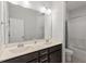 Bathroom featuring double vanity with sinks, toilet, and tub at 3418 Longleaf Estates Dr, Raleigh, NC 27616
