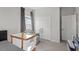 Bedroom features a crib and chair and closet at 3418 Longleaf Estates Dr, Raleigh, NC 27616