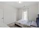 Bedroom with a view of the outside, has a bed at 3418 Longleaf Estates Dr, Raleigh, NC 27616