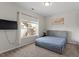 Bedroom features a window with a view of the outside staircase and a queen bed at 3418 Longleaf Estates Dr, Raleigh, NC 27616