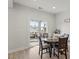 Bright breakfast nook with hardwood floors and sliding glass doors leading to a screened porch at 3418 Longleaf Estates Dr, Raleigh, NC 27616