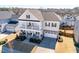 Charming two-story home with a two-car garage, a double stacked front porch, and landscaped front yard at 3418 Longleaf Estates Dr, Raleigh, NC 27616