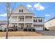 Charming two-story home with a two-car garage, a double stacked front porch, and landscaped front yard at 3418 Longleaf Estates Dr, Raleigh, NC 27616